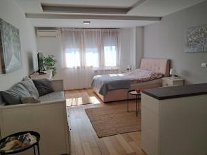 Postel nebo postele na pokoji v ubytování Manhattan studio A blok