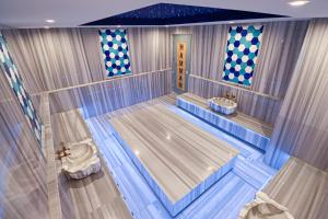 an empty indoor bowling alley with at Terra Apartments in Caesar Blue Resort, Fixed Lunch till 3pm, Gym, Heated pool, Sauna, Kids club in Rizokarpaso
