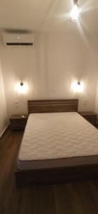 Postel nebo postele na pokoji v ubytování Αίγλη Apartment