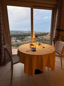 a table in a room with a large window at Casa dello Yoga Suite e Private Spa in Colonnella