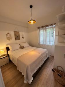 a bedroom with a large white bed in a room at Holiday House Jagoda -First Row to the Sea Brbinj in Brbinj