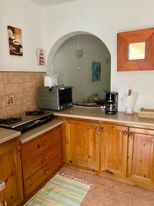 Kuchyň nebo kuchyňský kout v ubytování La Preneuse sur Mer Appartement