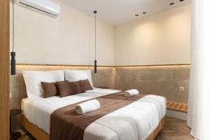 Postel nebo postele na pokoji v ubytování Dea Del Porto Wellness & Spa Suites