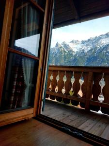 a room with a window with a view of mountains at Haus Sonnenruh in Mittenwald