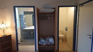 a bathroom with a mirror and a sink and a toilet at Auberge le Cévenol in La Cavalerie +31 photos