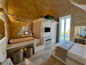 Postel nebo postele na pokoji v ubytování Vittorio Emanuele Charming Suites
