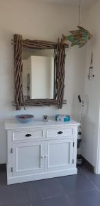 a bathroom with a white sink and a mirror at VILLA climatisée tout confort Proche mer et montagne 3 chbres in Campodiloro