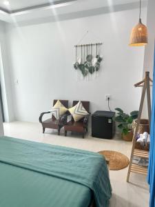 Ένα ή περισσότερα κρεβάτια σε δωμάτιο στο Homestay Minh Hà