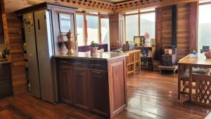 a kitchen with a large island in the middle of a room at Tara Homestay in Darjeeling