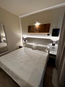 Postel nebo postele na pokoji v ubytování Confidence Hotel Parma