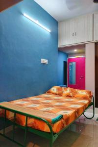 Ένα ή περισσότερα κρεβάτια σε δωμάτιο στο Y's Independent 2BHK Home