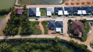 an overhead view of a row of houses with roofs at Sea & Sand House in Ban Khlong Khut