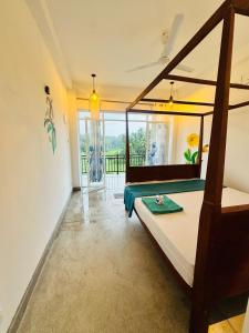 a bedroom with a bed and a large window at Southern grace unawatuna in Unawatuna +91 photos