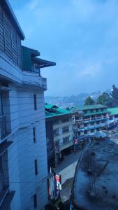 a building with a train tracks next to it at Tara Homestay in Darjeeling
