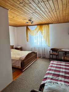 Postel nebo postele na pokoji v ubytování Горизонт
