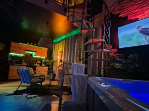 TV a/nebo společenská místnost v ubytování Appartement SPA Safari