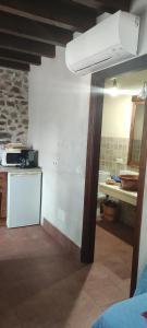 a kitchen with a counter and a sink in a room at Casa Rural Vallehermoso in San Carlos del Valle