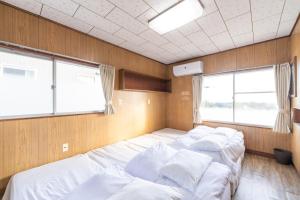 古民家民泊ーよかよーにあるベッド