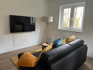 Μια τηλεόραση ή/και κέντρο ψυχαγωγίας στο Gartenapartment 1 +3 φωτογραφίες