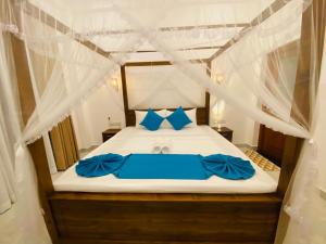 Postel nebo postele na pokoji v ubytování Sithuka Villa Bentota