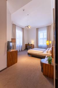 Postel nebo postele na pokoji v ubytování Herzogshof - Boutique-Hotel am Dom