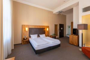 Postel nebo postele na pokoji v ubytování Herzogshof - Boutique-Hotel am Dom