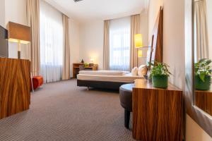 Postel nebo postele na pokoji v ubytování Herzogshof - Boutique-Hotel am Dom