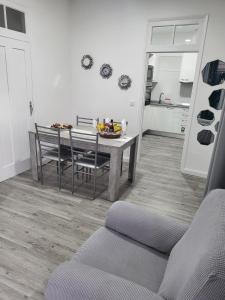 a kitchen with a table and chairs in a room at Casa Pereira 1 in Ponta do Pargo