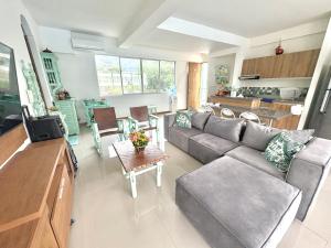 a living room with a couch and a table at Apartamento Vacacional San Jerónimo in Medellín