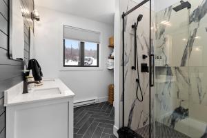 a bathroom with a sink and a shower at Flatrock Ocean View Sauna 3B 35BA in Flat Rock +66 photos