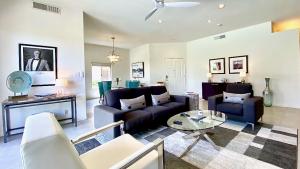 a living room with a couch and a table at Splash Pad in Rancho Mirage