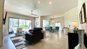 a living room with a couch and a table at Splash Pad in Rancho Mirage