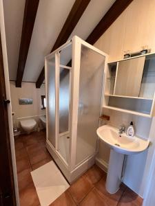 a bathroom with a shower and a sink at Kite House Tarifa in Tarifa