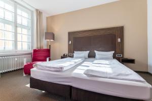 Postel nebo postele na pokoji v ubytování Herzogshof - Boutique-Hotel am Dom