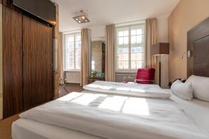 Postel nebo postele na pokoji v ubytování Herzogshof - Boutique-Hotel am Dom