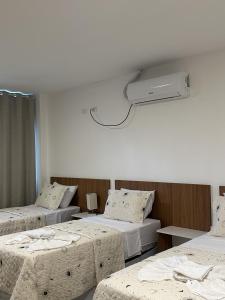 Postel nebo postele na pokoji v ubytování Hotel Formosa - Posto da Mata