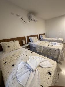 Postel nebo postele na pokoji v ubytování Hotel Formosa - Posto da Mata