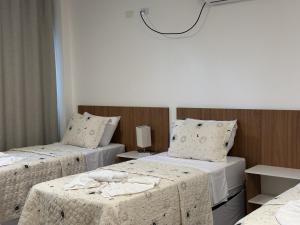 Postel nebo postele na pokoji v ubytování Hotel Formosa - Posto da Mata