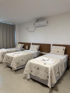 Postel nebo postele na pokoji v ubytování Hotel Formosa - Posto da Mata