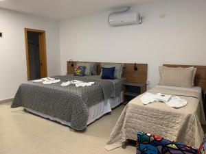 Postel nebo postele na pokoji v ubytování Hotel Formosa - Posto da Mata