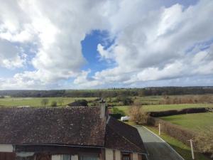 a view from the roof of a house in the countryside at Hôtel de la Risle in Ambenay