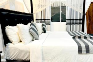 Postel nebo postele na pokoji v ubytování O2 Villas-Weligama