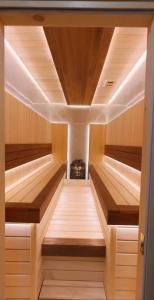 a sauna with wooden floors and a ceiling at Avant Express Hotel Pool&Spa in Tashkent