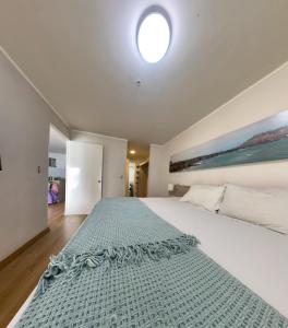 Ένα ή περισσότερα κρεβάτια σε δωμάτιο στο Urbano Apartments