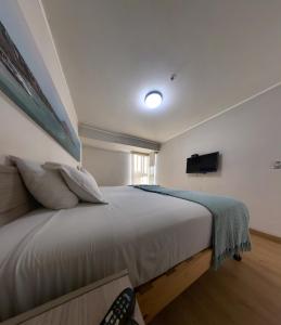 Ένα ή περισσότερα κρεβάτια σε δωμάτιο στο Urbano Apartments