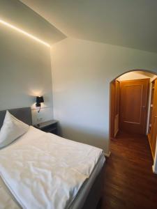 Postel nebo postele na pokoji v ubytování Gasthaus - Hotel Alt Fürstätt