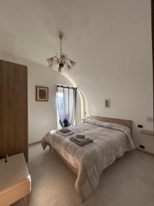 A bed or beds in a room at La Minicasa