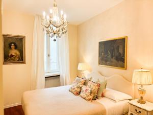 En eller flere senge i et værelse på Palazzo Tiolo