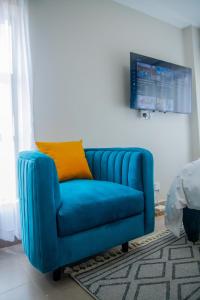 TV a/nebo společenská místnost v ubytování Nyayo View Studio with Amazing Views