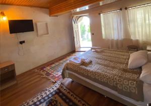 TV a/nebo společenská místnost v ubytování Peri Cave Hotel + 30 fotografií